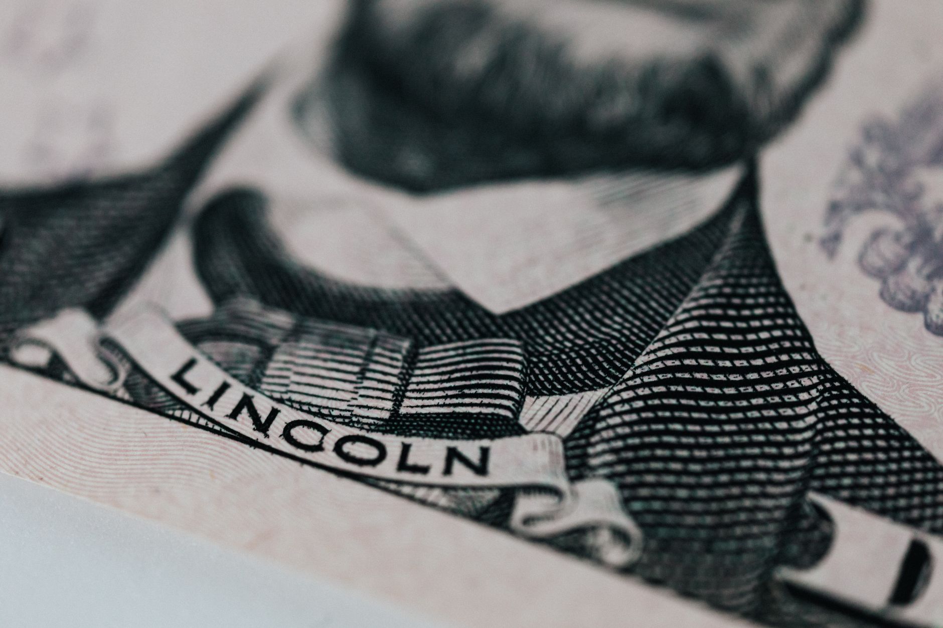 Portraits of renowned economic thinkers like Adam Smith, Keynes, and Hayek representing foundational theories.